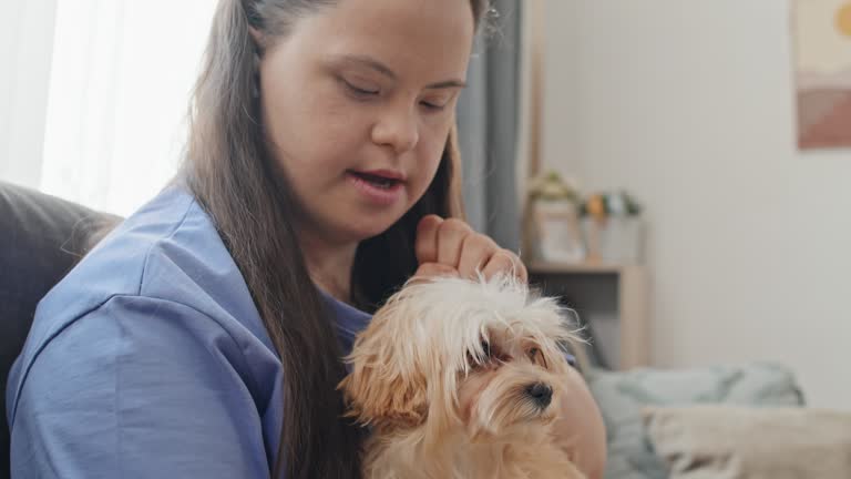 Young Woman With Disability And Her Cute Dog