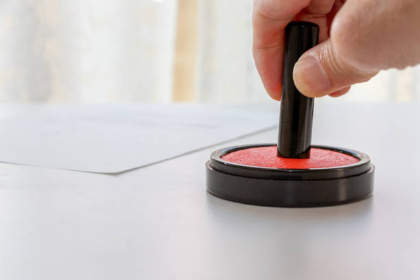 istock Japanese seal pressed against a red ink pad 1487228040