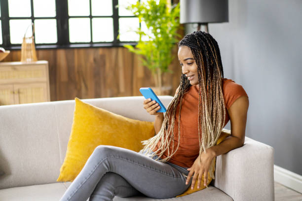 istock A young woman is texting on telephone 1487228720