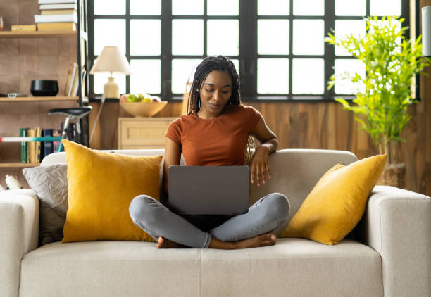 istock A latin girl is writing while studying at home 1487228728