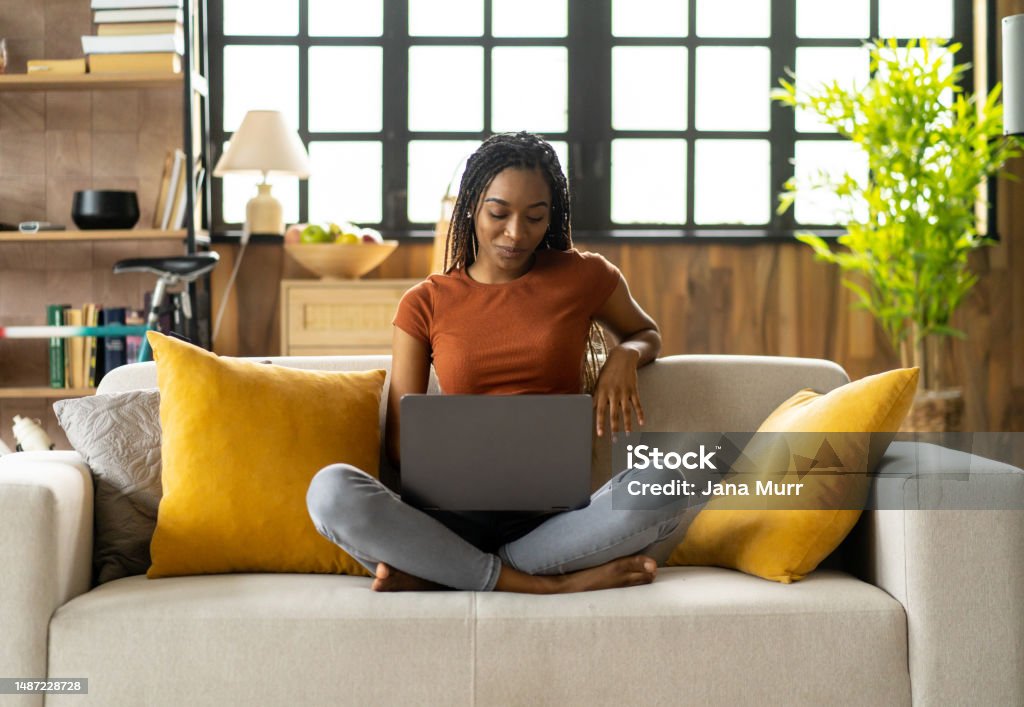 A latin girl is writing while studying at home A beautiful young girl is learning for University 20-24 Years Stock Photo