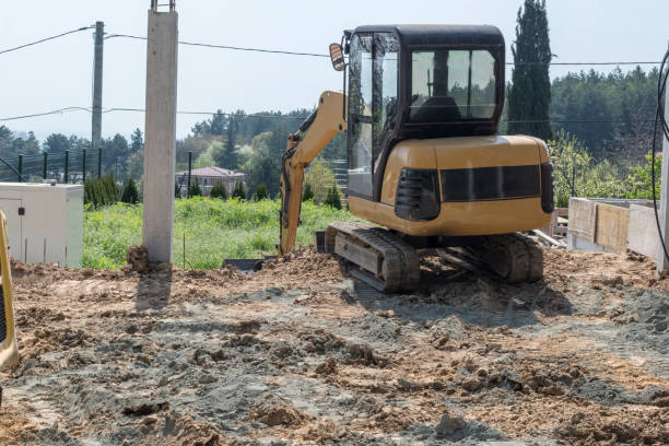 istock A small excavator in the park that prepares the asphalt pitch. 1487230988