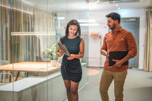 istock Male and Female Colleagues Using Digital Tablet for Business Discussion 1487231745