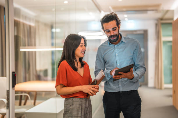 istock Multiethnic Coworkers Analyzing Data on Tablet in the Workplace 1487231750