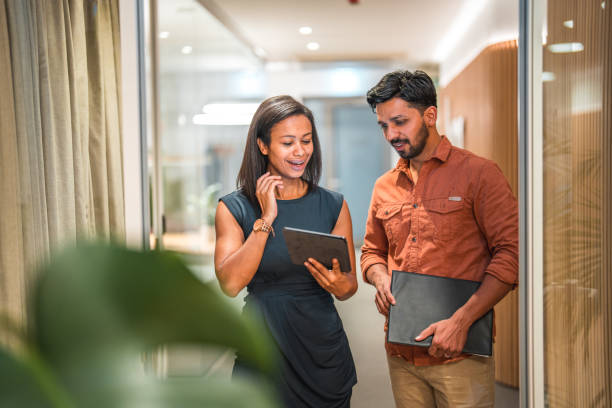 istock Successful Multiracial Colleagues Collaborating on a Digital Tablet 1487231756