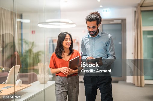 istock Diverse Colleagues Working Together on Digital Tablet 1487231759