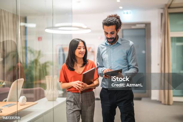 Diverse Colleagues Working Together On Digital Tablet Stock Photo - Download Image Now