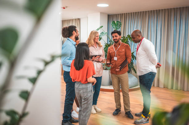 istock Multiracial Colleagues Discussing Progress in Modern Office 1487231778