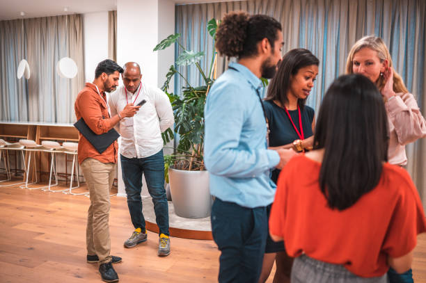 istock Mixed Ethnicity Coworkers Using Wireless Technology in Modern Corporate Workplace 1487231792