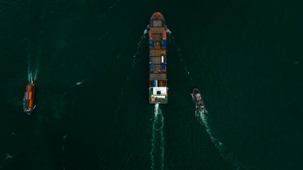 istock Container ship carrying container for import and export international in sea aerial top view photograph from drone 1487235393
