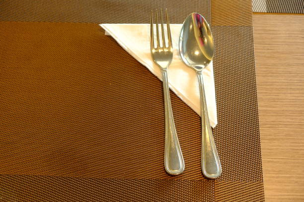 spoons and forks on a wooden table. cutlery.