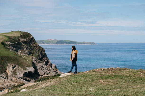 istock Young woman by the sea 1487240452