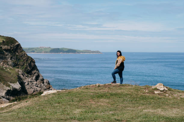 istock Young woman by the sea 1487240475