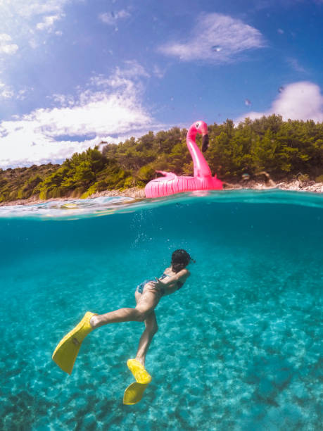 istock Children Having Fun With Inflatable Pelican 1487240851
