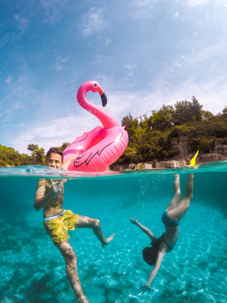 istock Children Having Fun With Inflatable Pelican 1487240863