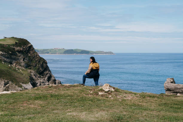 Young woman by the sea