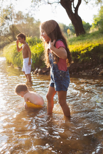 istock Children refreshing in the river 1487241053