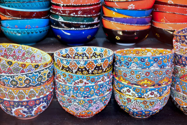 istock Decorative hand painted ceramic bowls with colorful patterns in arts and crafts store, souk flea market in Middle East 1487241851
