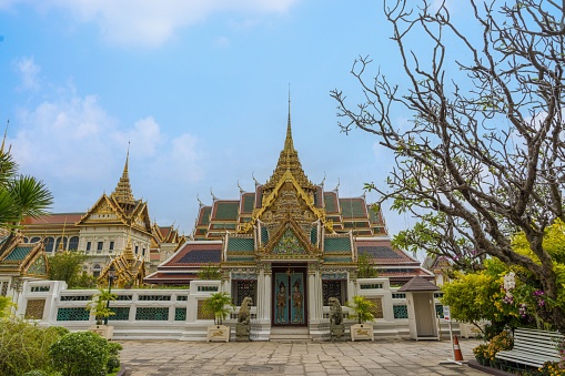 The gate with background of Dusit Maha Prasat and Chakri Maha Prasat in Grand palace, Bangkok, Thailand