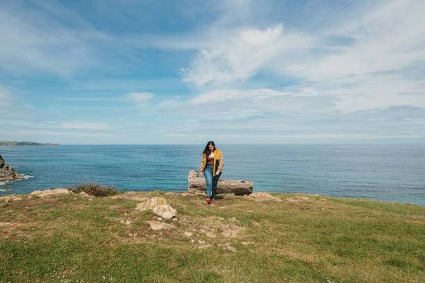 istock Young woman by the sea 1487244891