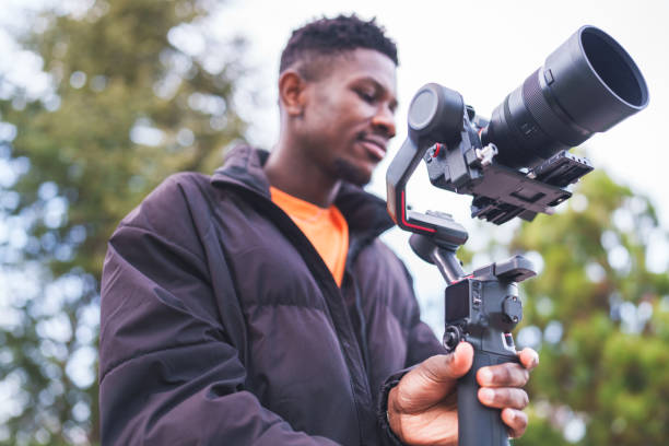 istock Cameraman filming with gimbal 1487246433