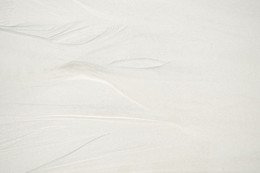 Texture Sand Background,Pattern Grain Beach Sea at Coast,White Granular Desert Fine Backdrop,Space Nature Summer Tropical Island Ocean thailand,Ground Sandy,Toursim Travel Vacation in Holiday Concept.