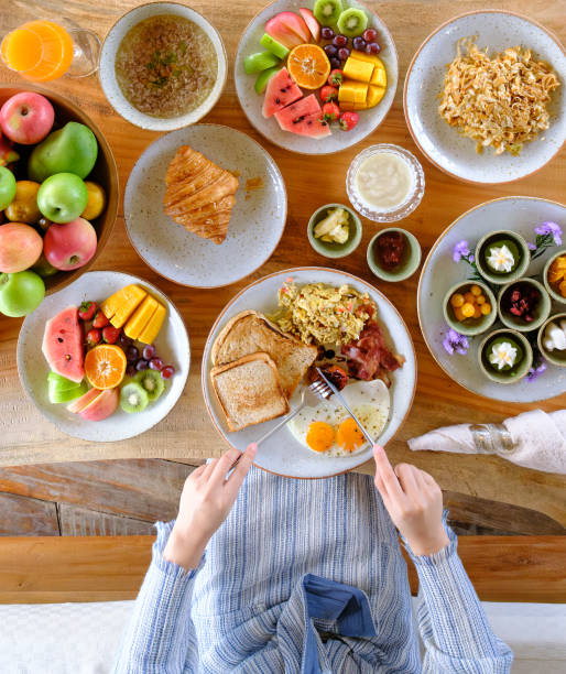 istock woman eating healthy breakfast on the table 1487250482