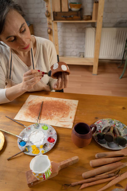 istock Woman painting a pottery 1487253127
