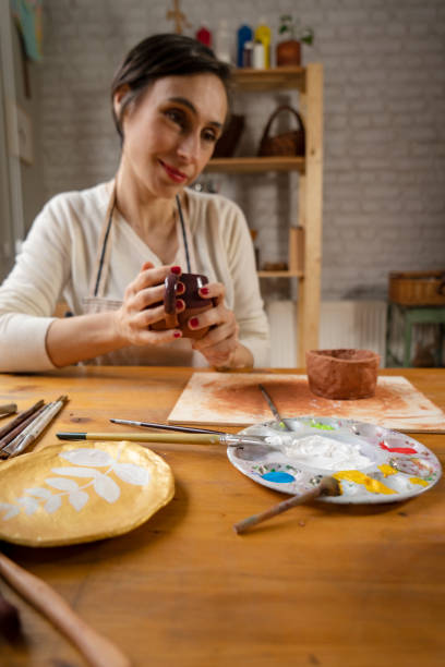 istock Ceramist artist female work in studio 1487254083