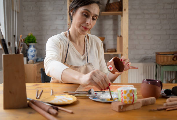 istock Woman painting a pottery 1487254383