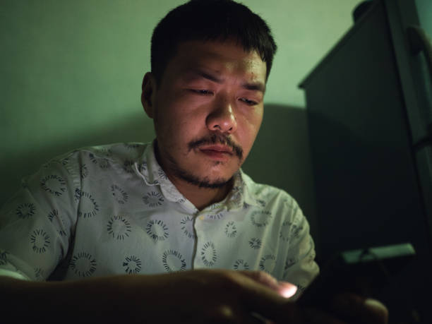 istock Gay man using smartphone at home 1487255762