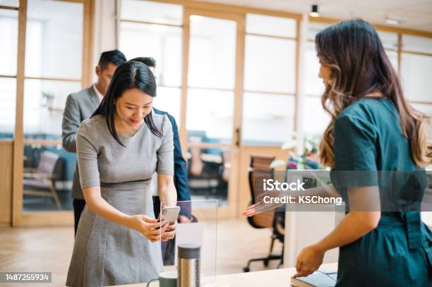 Asian Chinese Businesswoman Scan Qr To Register For The Business Conference Stock Photo - Download Image Now