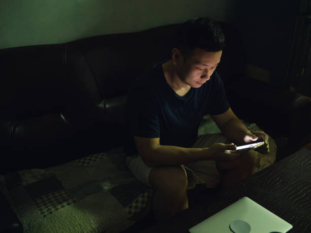 istock Gay man using smartphone at home 1487255967