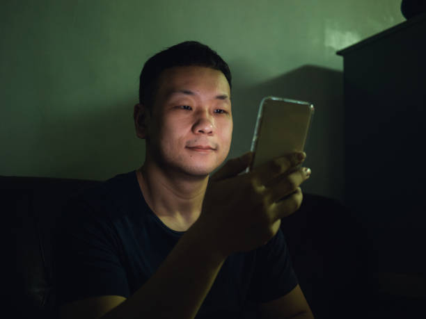 istock Gay man using smartphone at home 1487256019