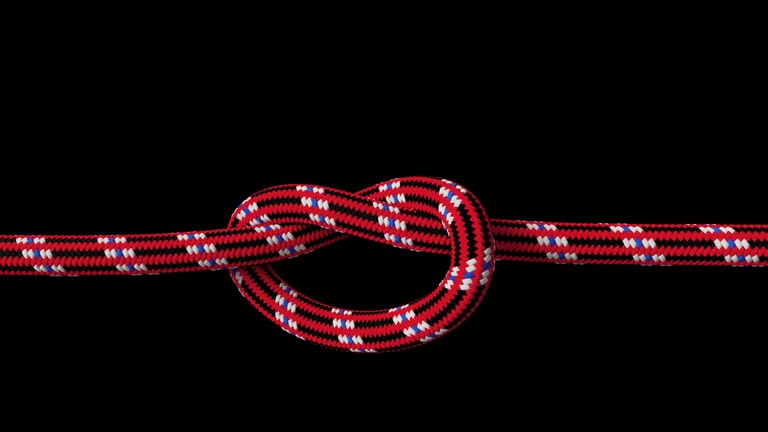 Red rope tightening in a knot
