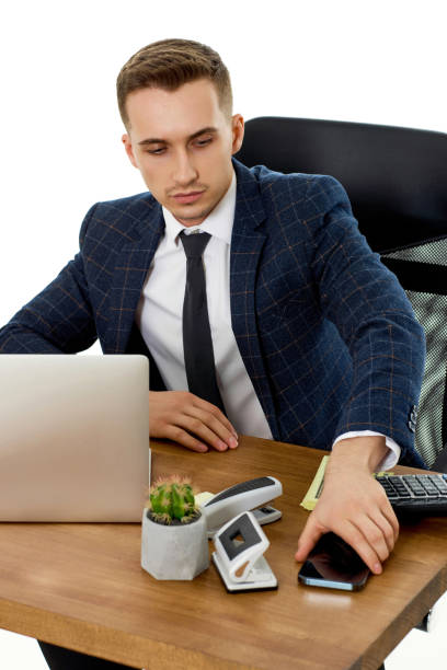 istock businessman working with laptop and using smartphone 1487257418