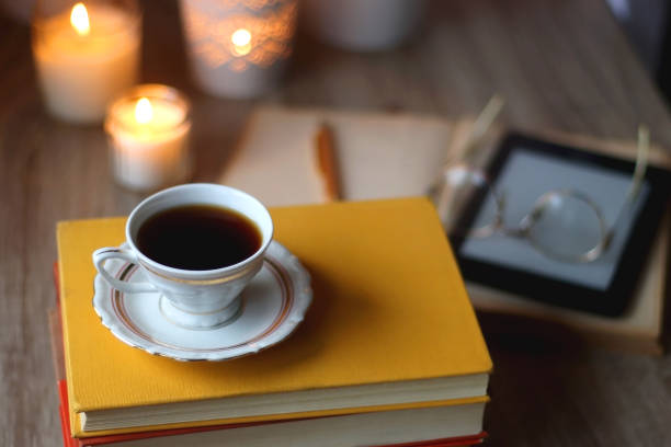 istock Books, Glasses, E-Reader, Pen, Tea, Cookies and Candles 1487259800