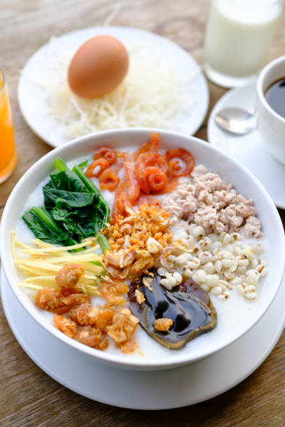 istock rice porridge with boiled egg,Milk,coffee and orange juice 1487260463