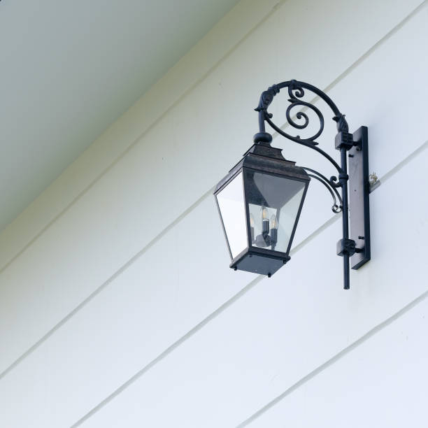 istock vintage lamp on the white wall 1487260464