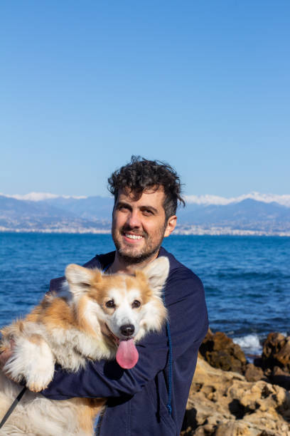 istock Corgi dog and human smiling 1487260855