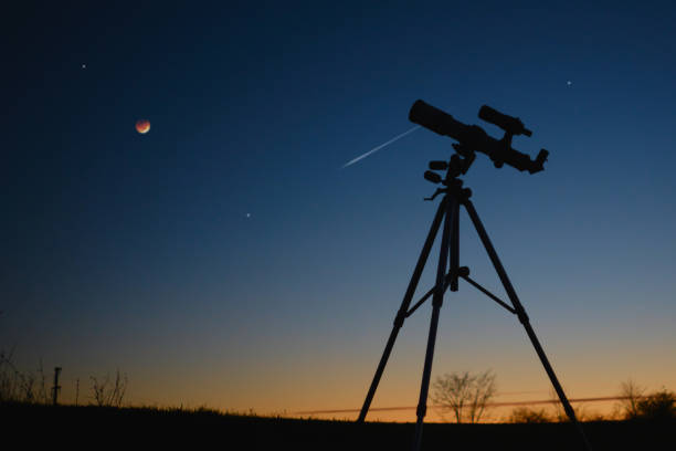 istock Astronomy telescope for observing stars, planets, Moon and other space objects with slightly out of focus stars on the sky. 1487260910