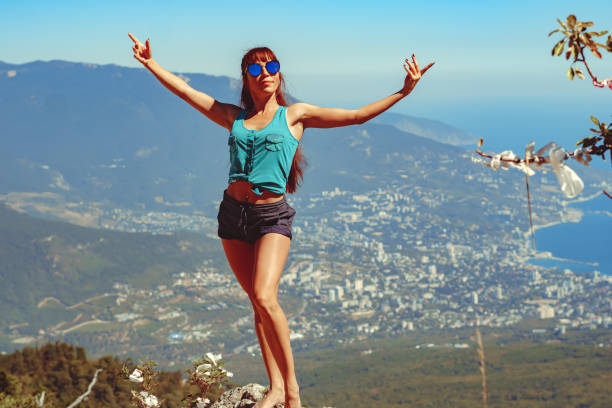 istock a beautiful girl stands on top 1487263949