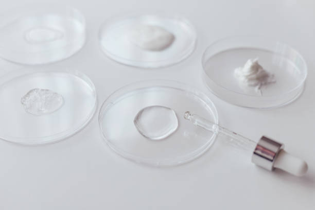 istock Cosmetics Samples in Laboratory Glassware on white background, consistency test of gel and cream 1487265402