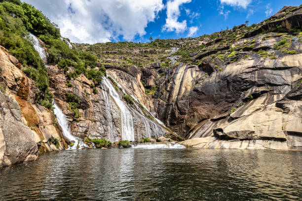 Ezaro waterfall, Galicia, Northern Spain in Spring. It empties into the Atlantic ocean in a waterfall stock photo
