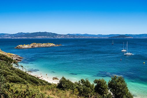 Beach Praia de Nosa Senora in Cies Islands nature reserve, white sand and clear turquoise water. Atlantic Islands of Galicia National Park, Spain.