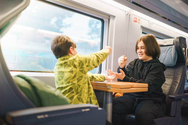 istock Children playing rock paper scissors in train 1487267868