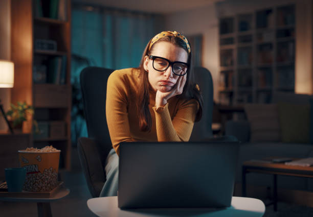 istock Woman using her laptop at home 1487268402