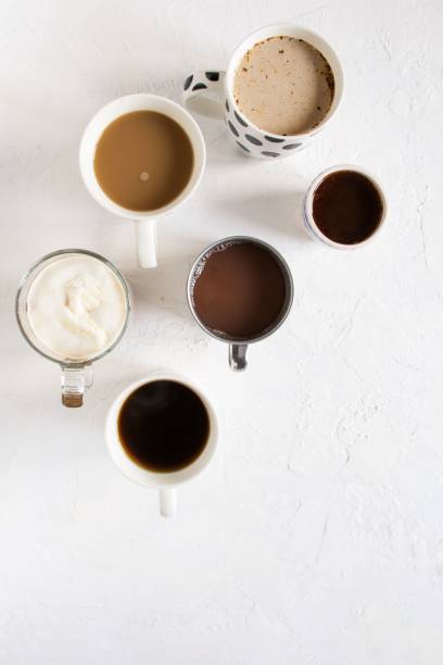 istock Top view of an array of assorted beverages, including cups of coffee, sitting on a flat surface 1487268645
