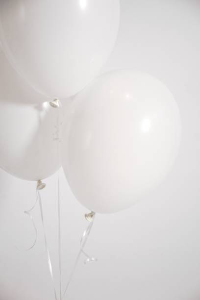 istock White balloons against a white background. 1487268679