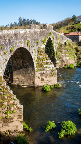 istock Roman stone bridge in Galicia, Spain 1487273706